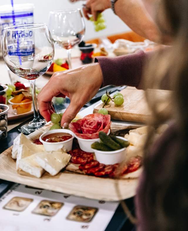 Arranging a board at a Charcuterie Board Workshop