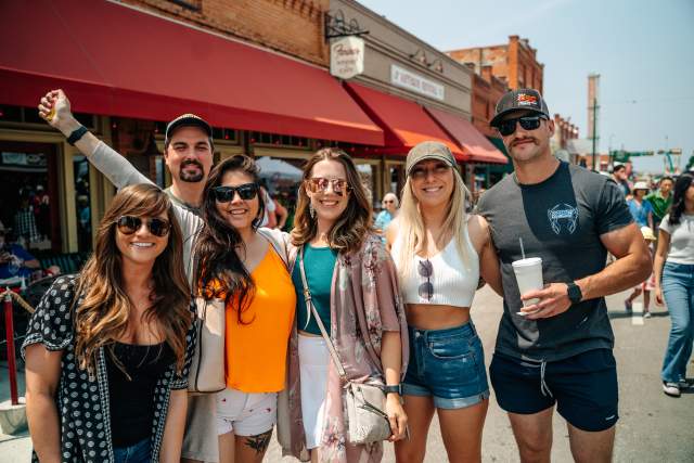 Group of people attending Main Street Fest in Grapevine, Texas