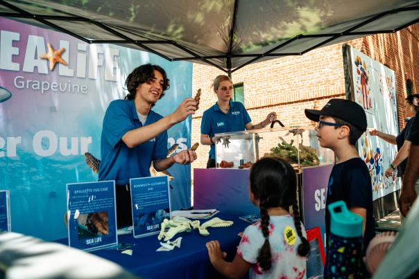 Kids enjoying the SEALIFE exhibit at Main Street Fest in Grapevine, Texas