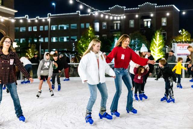 Skaters enjoying Peace Plaza Ice Rink in Grapevine during Christmas Capital of Texas
