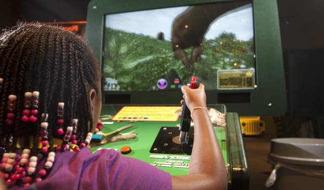 Video game being played in Be The Dinosaur Exhibit