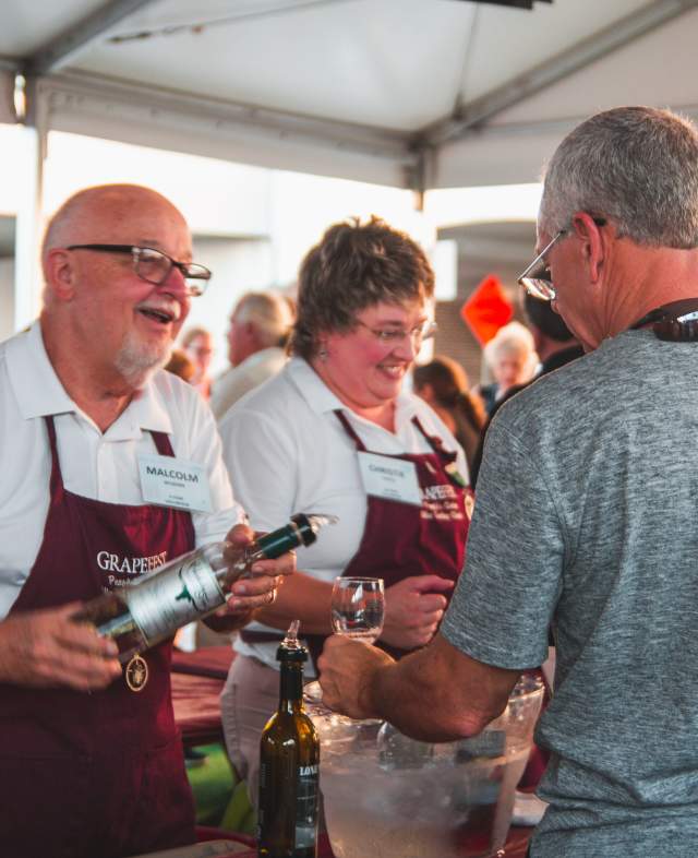 Volunteers serving guests at Grapefest in Grapevine, Texas