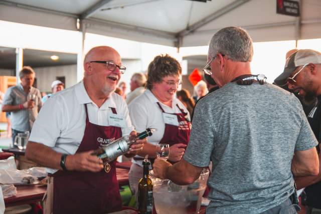 Volunteers serving guests at Grapefest in Grapevine, Texas