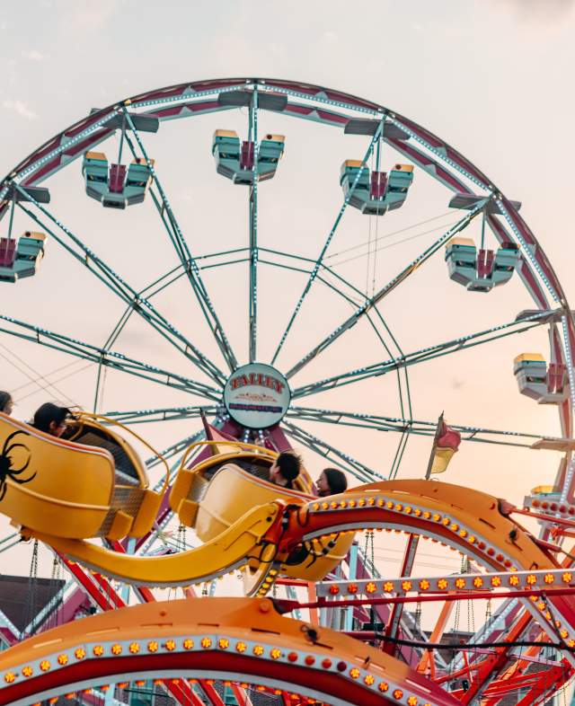 People on carnival rides at Main Street Fest in Grapevine, Texas